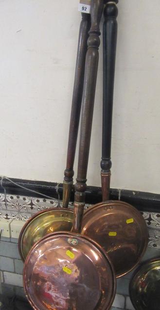 THREE BRASS BED WARMERS Image