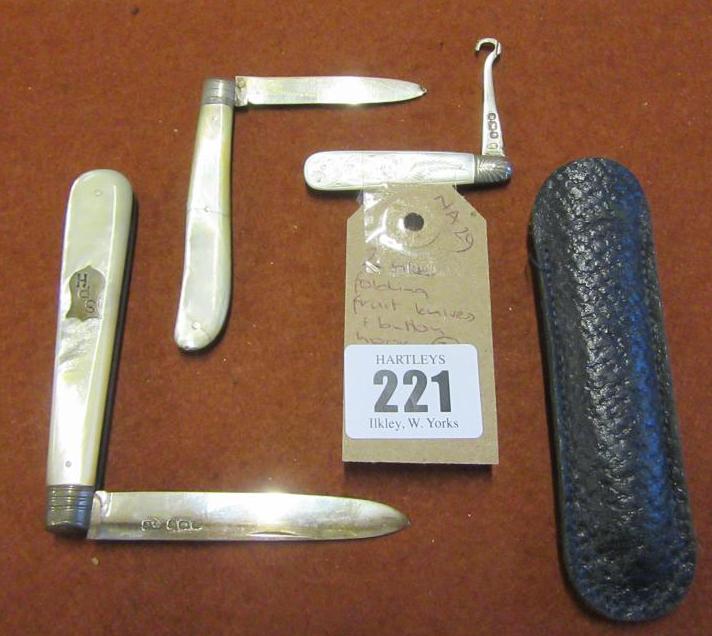 TWO SILVER FOLDING FRUIT KNIVES AND A BUTTON HOOK Image