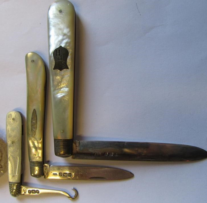 TWO SILVER FOLDING FRUIT KNIVES AND A BUTTON HOOK Image