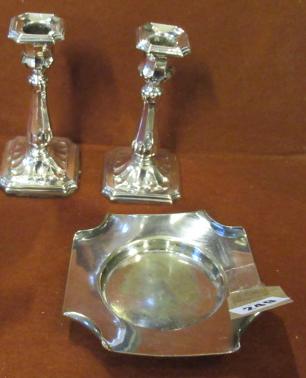 PAIR OF SILVER CANDLESTICKS AND A PLATED ASHTRAY Image