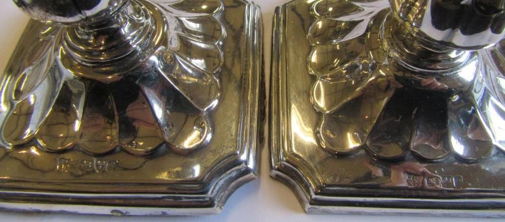 PAIR OF SILVER CANDLESTICKS AND A PLATED ASHTRAY Image