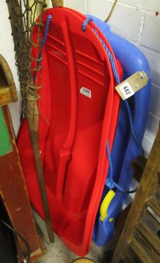 THREE PLASTIC SLEDGES Image