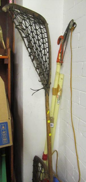 TWO LACROSSE STICKS AND A TREE LOPPER Image