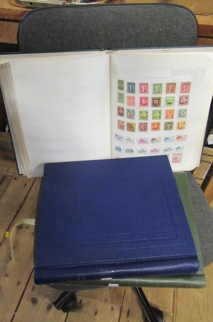 THREE ALBUMS OF WORLD STAMPS Image