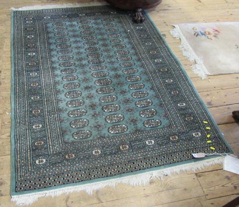 GREEN PATTERNED FRINGED RUG 6' BY 4'2" Image