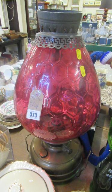 OIL LAMP WITH CRANBERRY GLASS SHADE Image