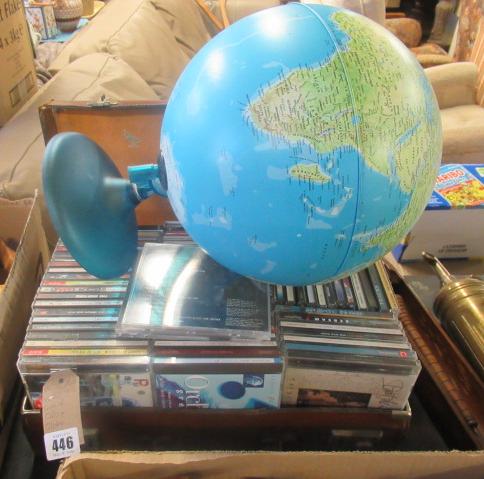 LEATHER CASE OF CDS AND A TABLE GLOBE Image
