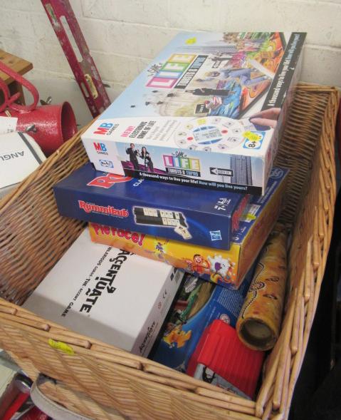 WICKER BASKET OF BOARD GAMES INCLUDING LACROSSE STICK Image