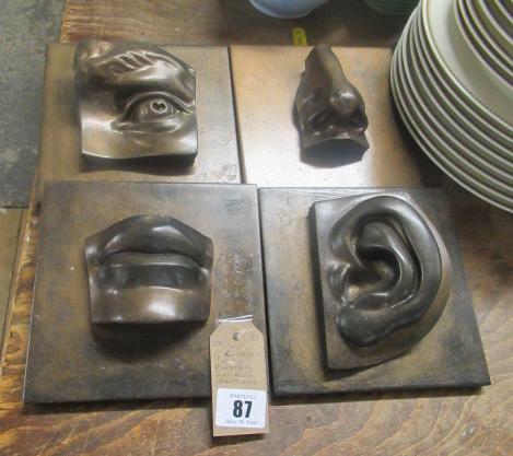 FOUR PLASTER FACIAL FEATURES Image