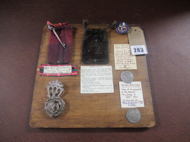 MOUNTED DISPLAY INCLUDING ROB ROY SOUVENIR KINGS SHILLING AND BROOCHES Image