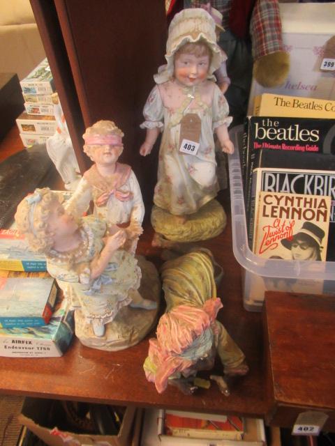 FOUR BISQUE FIGURES Image