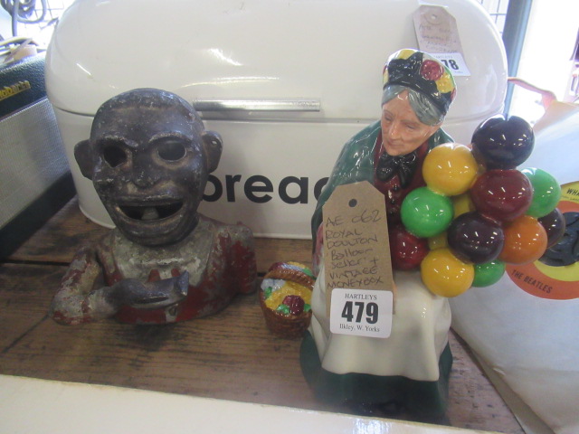 ROYAL DOULTON BALLOON SELLER FIGURE AND A VINTAGE MONEY BOX Image