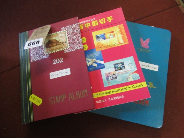 TWO SMALL STOCK BOOKS OF CHINESE STAMPS AND A 2004 CATALOGUE Image