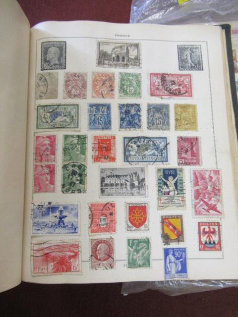 TWO STAMP ALBUMS AND A BAG OF STAMPS Image