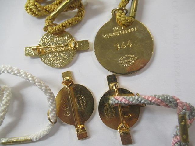 BOX OF COINS AND RACE COURSE BADGES Image