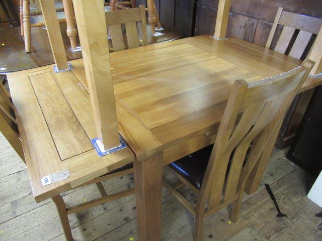 DINING TABLE AND FOUR CHAIRS Image