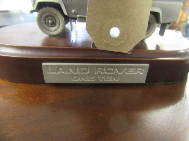 TWO LANDROVER MODELS ON PLINTHS Image