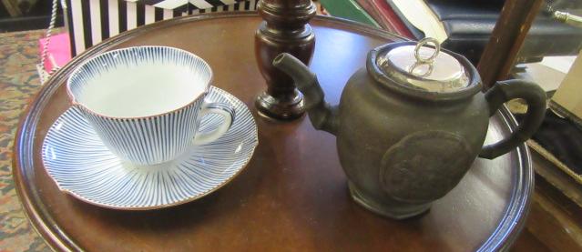 CHINA CUP AND SAUCER AND CHINESE TEAPOT Image
