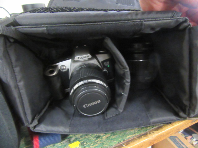 CASED CANON EOS 500 CAMERA AND A LENS  Image
