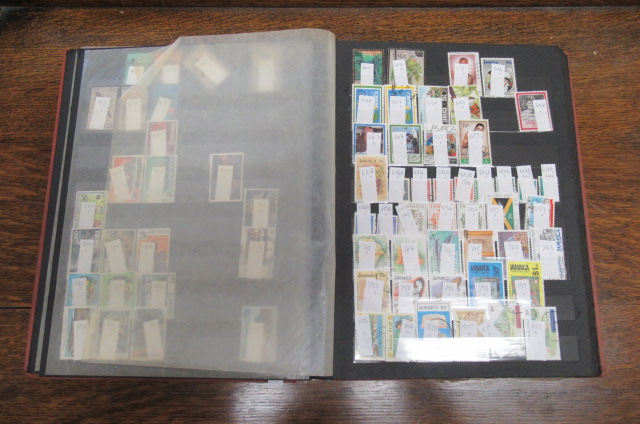 STOCK BOOK OF STAMPS FROM JAMAICA ETC Image