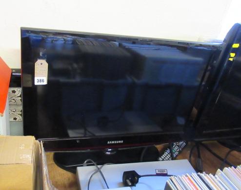 SAMSUNG FLATSCREEN TV AND A  DVD PLAYER Image