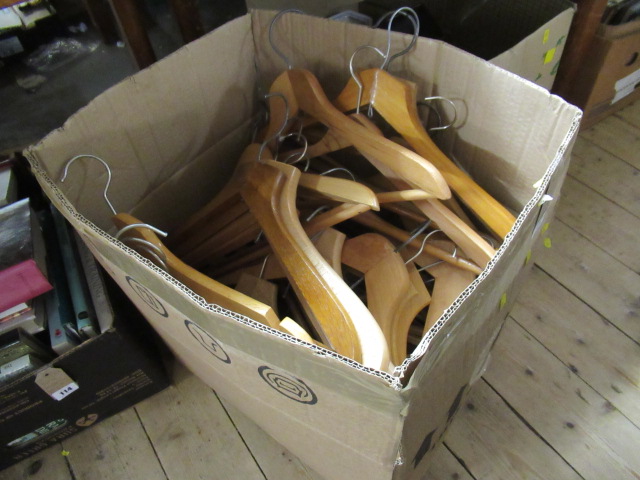 BOX OF WOODEN COAT HANGERS Image