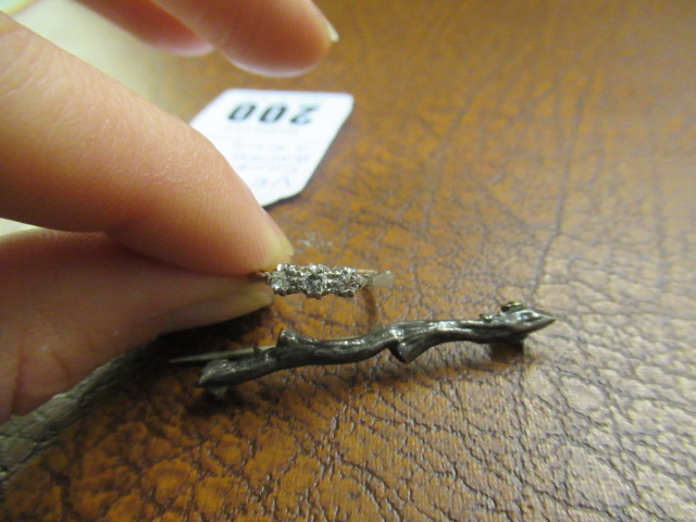 SILVER BROOCH AND A RING Image