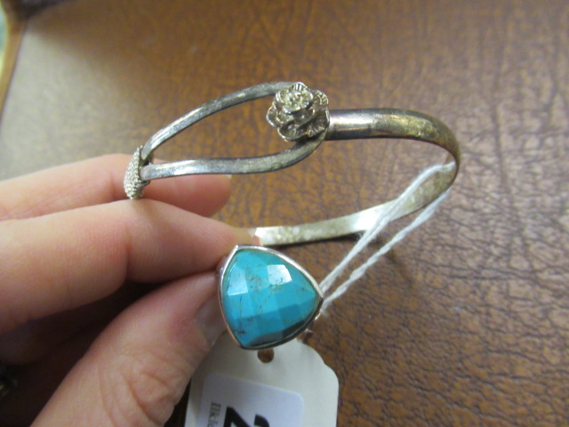SILVER AND TURQUOISE RING AND A SILVER BANGLE Image