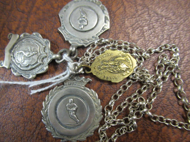 THREE SILVER PENDANTS AND ANOTHER Image