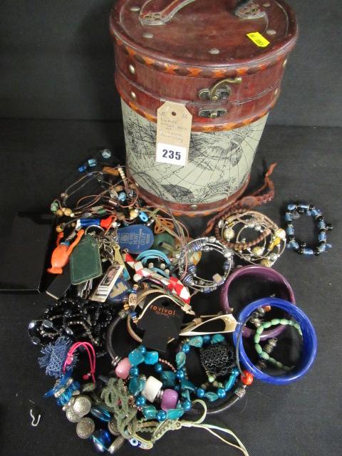 CIRCULAR ATLAS BOX OF COSTUME JEWELLERY Image