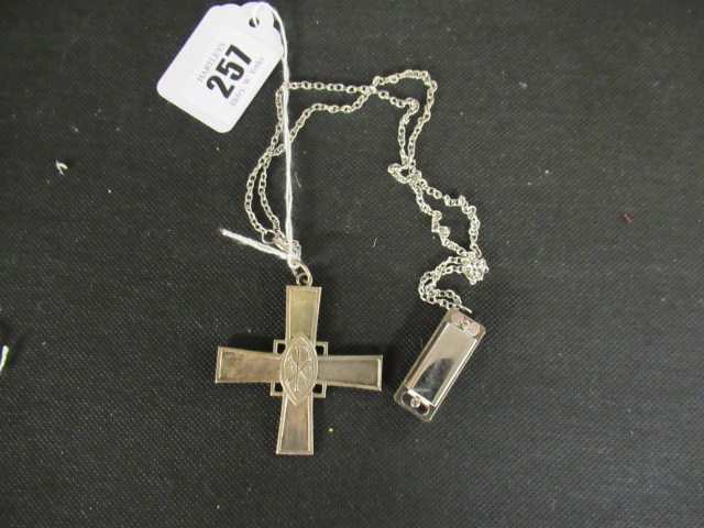 A SILVER CROSS AND MINIATURE HARMONICA ON CHAIN Image