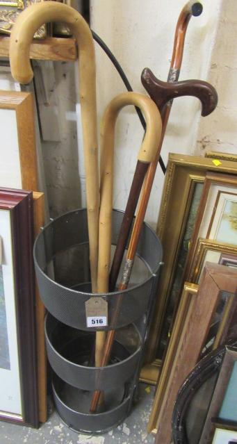 FOUR WALKING STICKS AND STAND Image