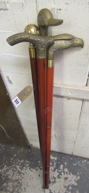 FOUR BRASS TOPPED WALKING STICKS Image