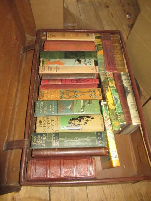 SUITCASE OF NOVELS WITH COLOURFUL SPINES Image