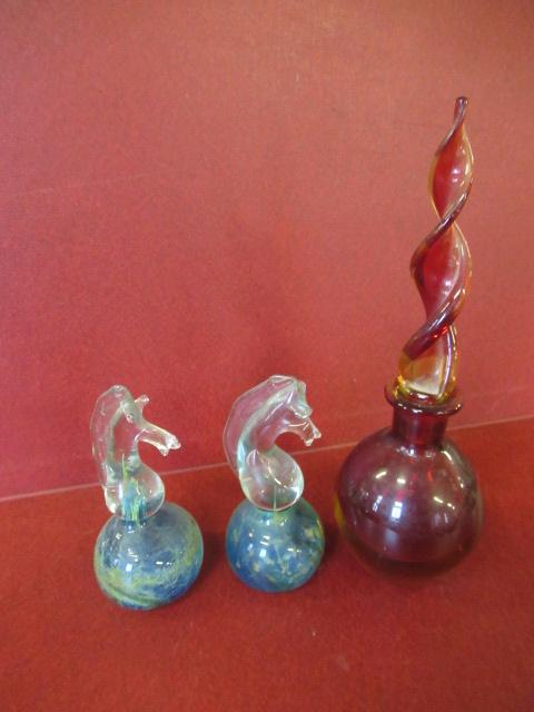 TWO GLASS PAPERWEIGHTS AND A BOTTLE Image
