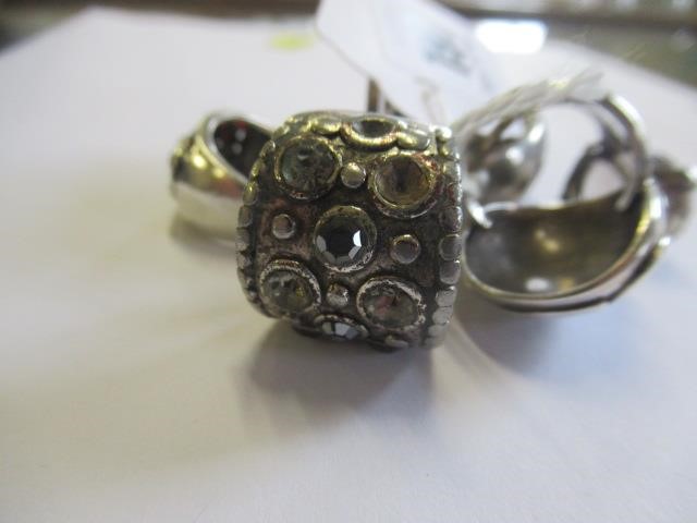THREE SILVER RINGS AND THREE OTHERS Image