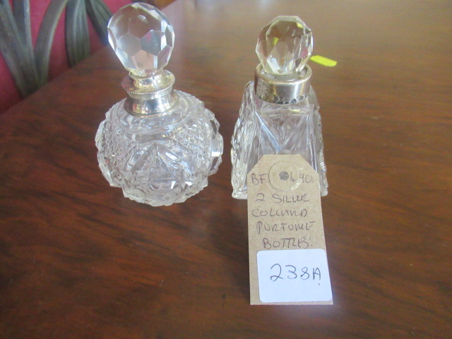 TWO SILVER COLLARED PERFUME BOTTLES Image