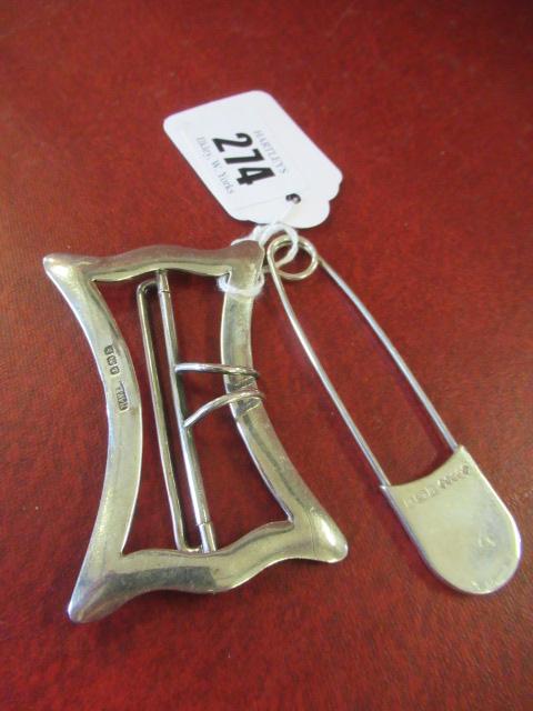 SILVER BUCKLE AND SAFETY PIN Image