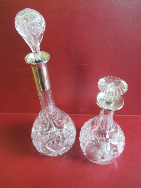 TWO SILVER COLLARED DECANTERS Image