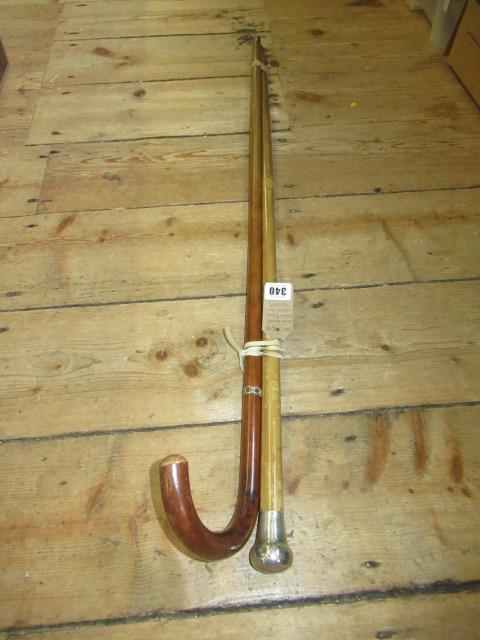 TWO SILVER MOUNTED WALKING STICKS Image