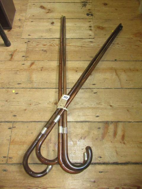 FOUR ANTIQUE SILVER MOUNTED WALKING STICKS Image