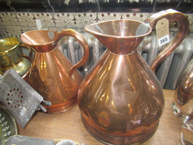 TWO LARGE COPPER JUGS Image