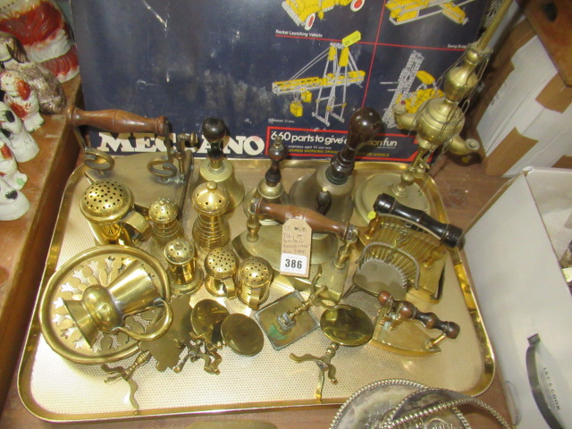 TRAY OF ANTIQUE BRASSWARE INCLUDING PEPPER POTS, FLAT IRONS AND BELLS Image