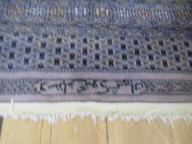 RED AND BLACK PATTERNED FRINGED RUG Image