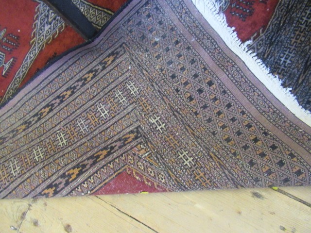 RED AND BLACK PATTERNED FRINGED RUG Image