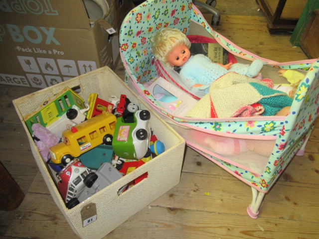 COT OF DOLLS AND BOX OF TOY VEHICLES Image