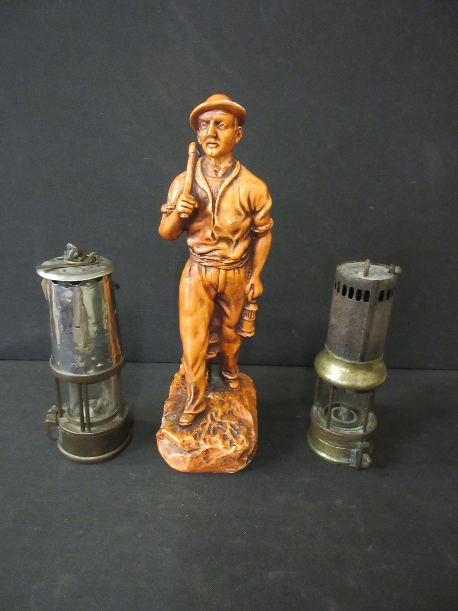 TWO MINERS LAMPS AND A MODEL OF A MINER Image