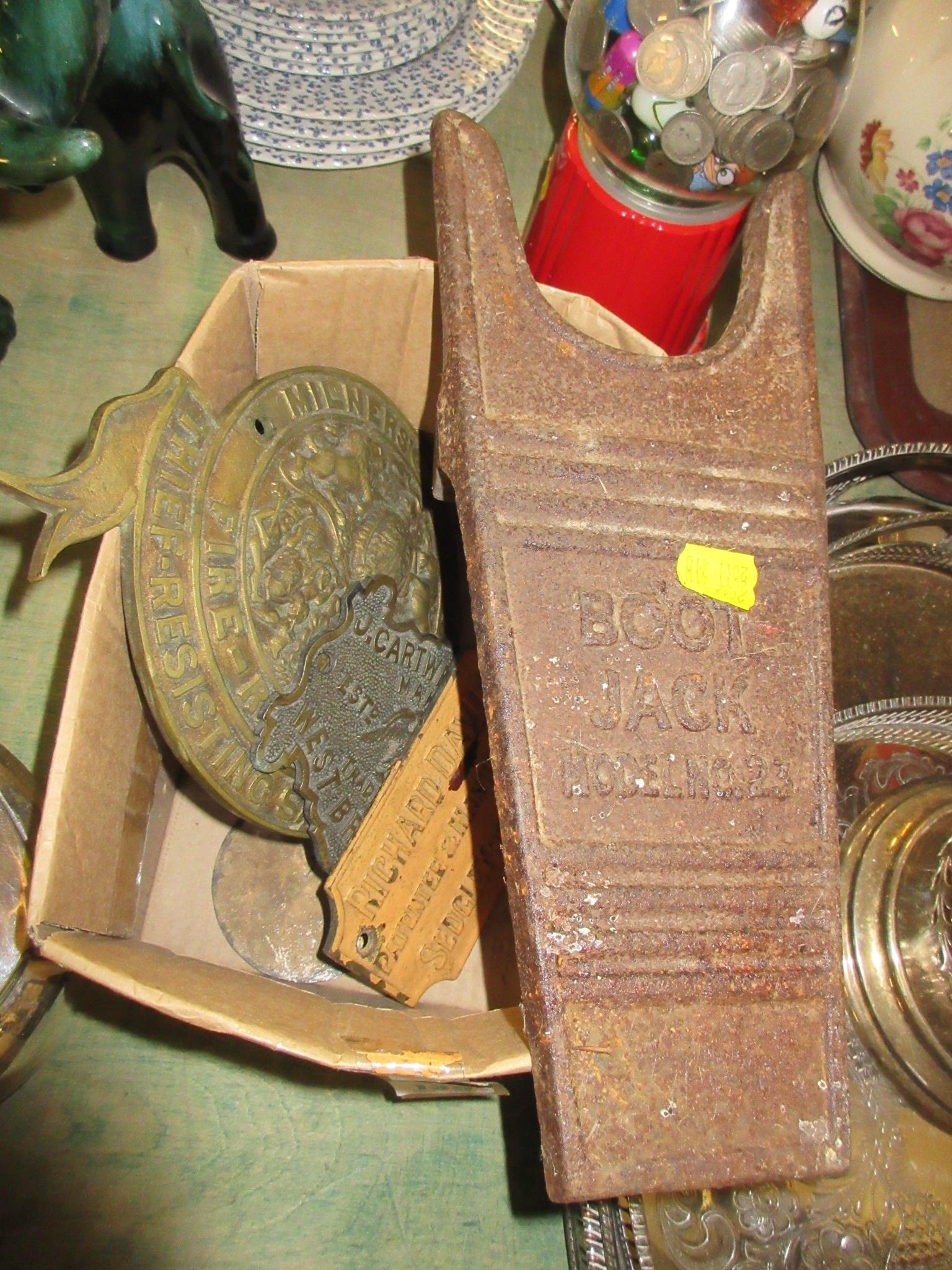 FOUR METAL PLAQUES AND A BOOT JACK Image