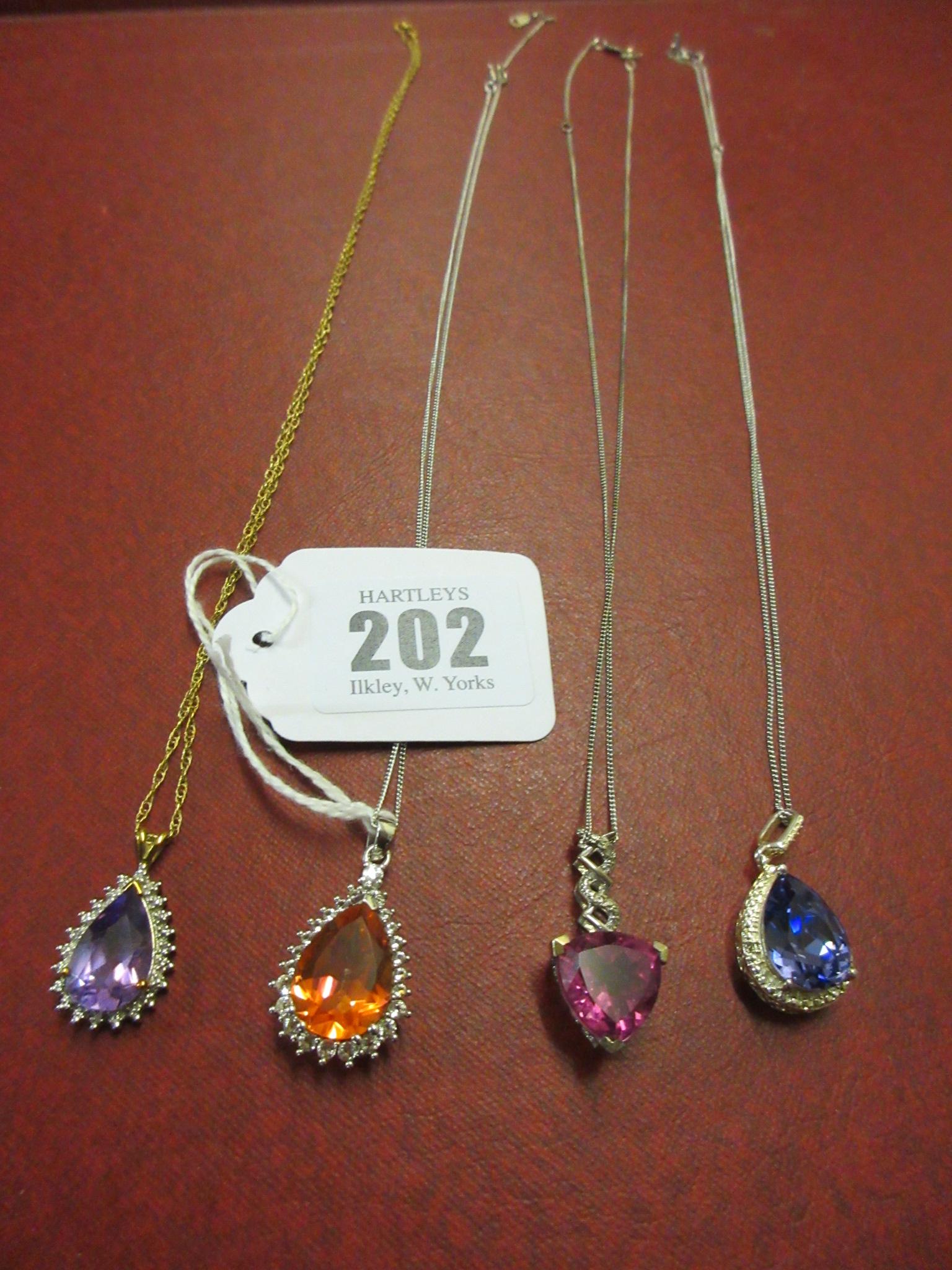FOUR SILVER PENDANTS ON SILVER CHAINS Image