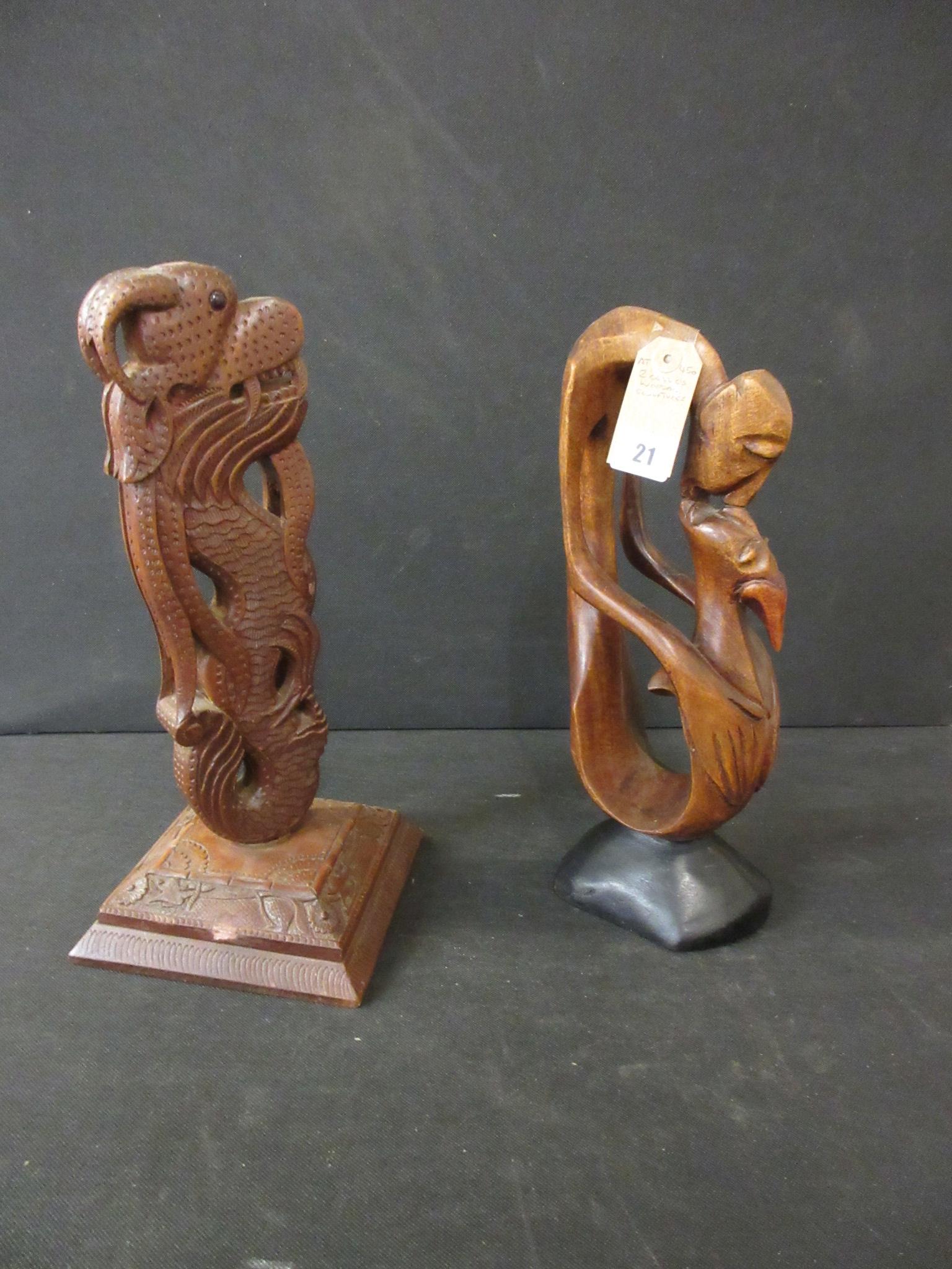 TWO CARVED WOODEN SCULPTURES Image